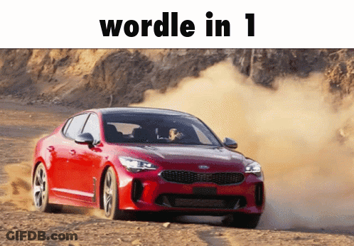 A Red Car Is Driving Down A Dirt Road With The Words Wordle In 1 Written Above It GIF