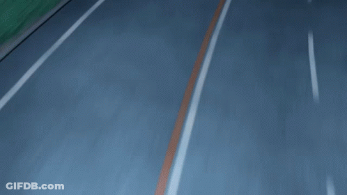 A Red Car Is Driving Down A Road With A License Plate That Says ' A ' GIF
