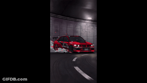 A Red Car Is Driving Through A Tunnel With Smoke Coming Out Of The Tires GIF