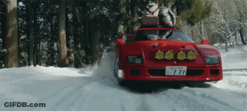 A Red Car With A License Plate That Has The Number 77 On It GIF