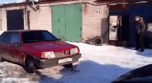 A Red Car With A License Plate That Says 3H089 Tn GIF