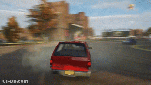 A Red Car With A License Plate That Says ' Nc ' On It GIF