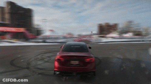 A Red Car With A New Jersey License Plate Is Driving On A Snowy Road GIF