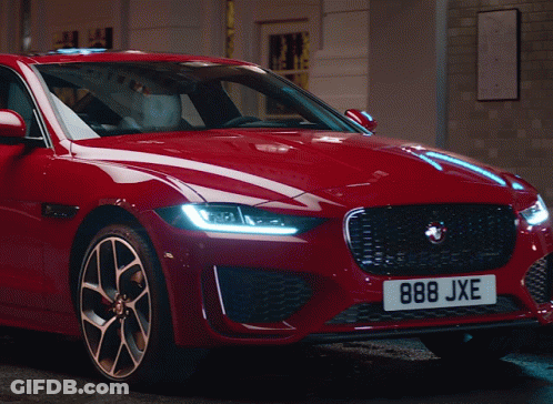 A Red Car With The License Plate 888Jxe GIF