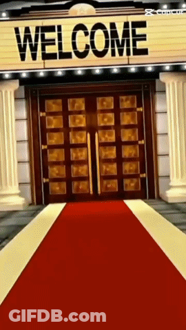 A Red Carpet Is Leading To A Large Welcome Sign GIF