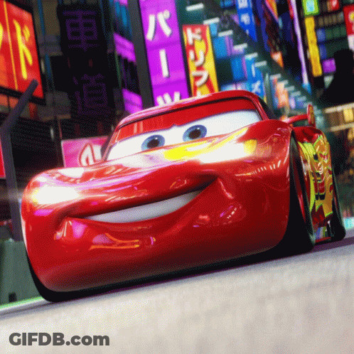 A Red Cartoon Car Is Driving Down A Street With A Sign That Says ' R ' On It GIF