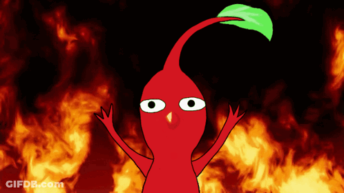 A Red Cartoon Character With A Green Leaf On Its Head Stands In Front Of A Fire Background GIF