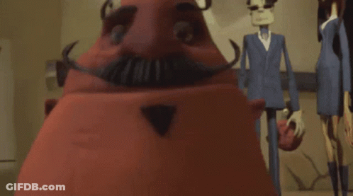 A Red Cartoon Character With A Mustache And A Triangle Nose GIF