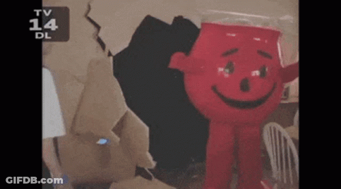 A Red Cartoon Character With A Smile On His Face Is On A Tv Screen GIF