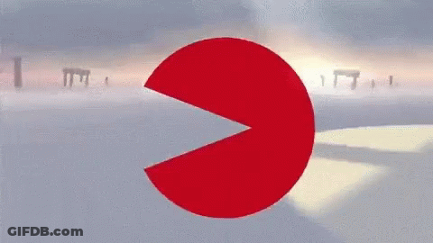 A Red Circle With A Slice Taken Out Of It And A Sunset In The Background GIF