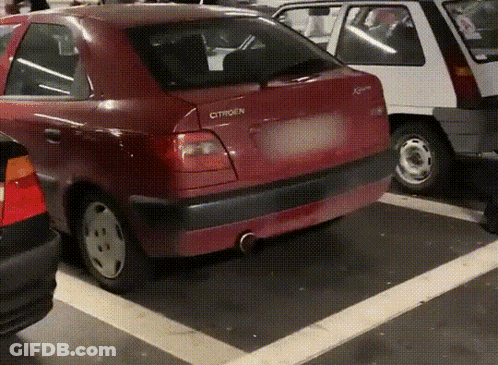 A Red Citroen Car Parked In A Parking Lot GIF