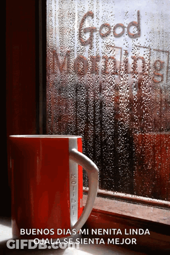 A Red Coffee Mug Sits In Front Of A Window With The Words Good Morning Written On It GIF