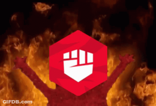 A Red Cube With A Fist Inside Of It Is Surrounded By Flames GIF