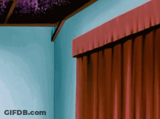 A Red Curtain Is Hanging On A Blue Wall In A Room GIF