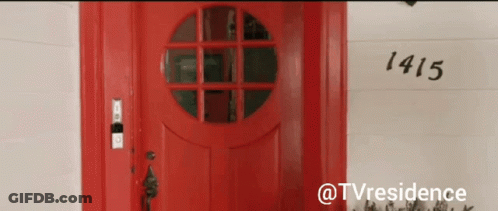 A Red Door With The Number 1415 On The Wall GIF