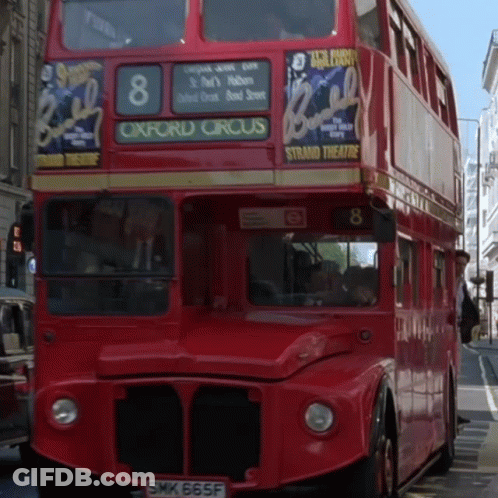 A Red Double Decker Bus Has The Number 8 On The Front GIF
