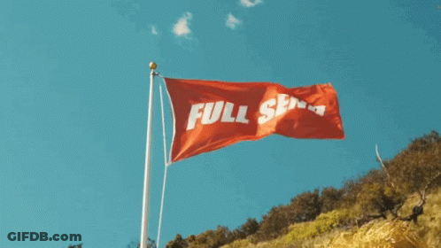 A Red Flag That Says Full Serve Is Flying In The Wind GIF