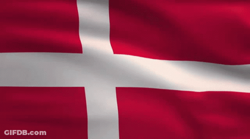 A Red Flag With A White Cross On It GIF