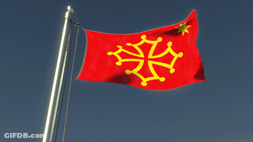 A Red Flag With A Yellow Cross Is Flying In The Wind GIF