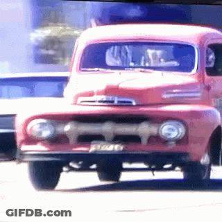A Red Ford Truck With A License Plate That Says ' E7a46 ' GIF