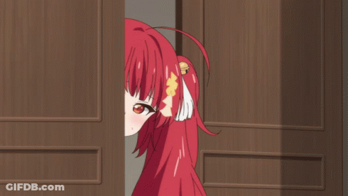 A Red Haired Anime Girl Is Peeking Out From Behind A Door GIF