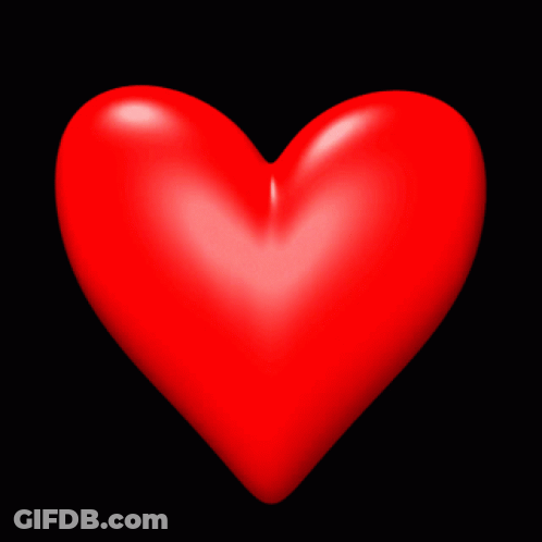 A Red Heart On A Black Background That Is Very Large GIF