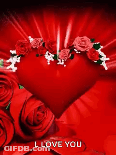 A Red Heart Surrounded By Red Roses With The Words `` I Love You '' On It . GIF