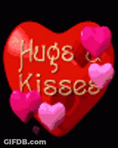 A Red Heart With The Words Hugs & Kisses Written On It GIF