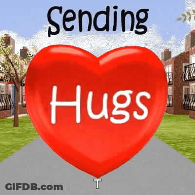 A Red Heart With The Words `` Sending Hugs '' On It . GIF