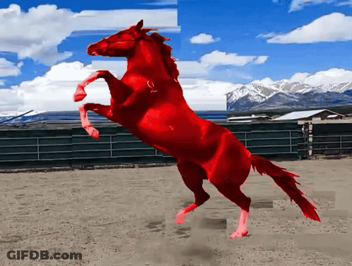 A Red Horse Is Standing On Its Hind Legs GIF