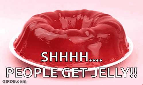 A Red Jelly Cake On A White Plate With The Words " People Get Jelly " Below It GIF