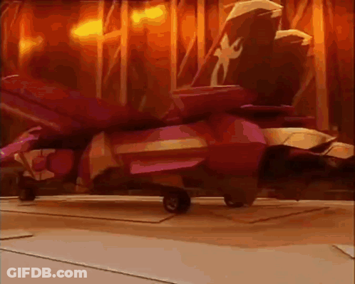 A Red Jet Is Sitting On A Runway In Front Of A Curtain . GIF