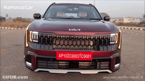 A Red Kia Car With A License Plate That Reads Ap102c003tc0001 GIF