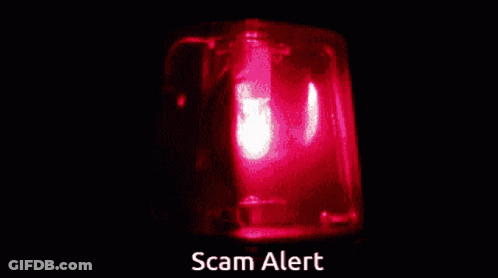 A Red Light With The Words Scam Alert Written Below It GIF