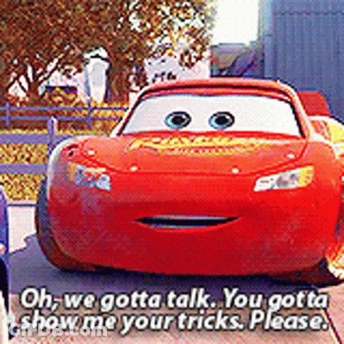 A Red Lightning Mcqueen Car Is Talking To Another Car . GIF