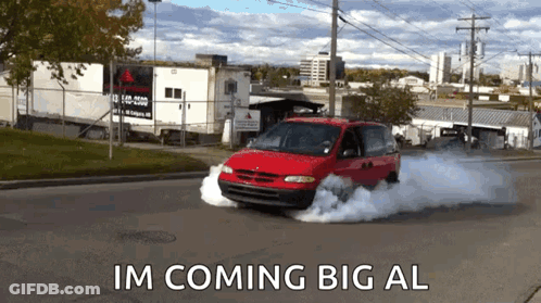 A Red Minivan Is Driving Down A Street With Smoke Coming Out Of It And The Words Im Coming Big Al GIF