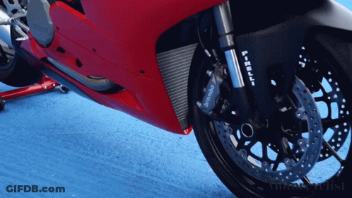 A Red Motorcycle With A Brembo Brake On It GIF