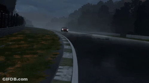 A Red Mustang Is Driving On A Wet Track GIF