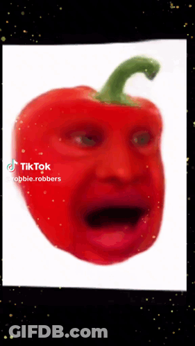 A Red Pepper With A Green Stem Looks Like A Person 'S Face GIF