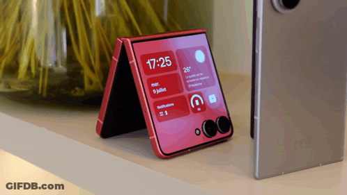 A Red Phone Displays The Time As 17:25 GIF