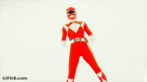 A Red Power Ranger Is Holding A Red Sword GIF