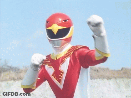 A Red Power Ranger With A Bird On His Helmet Is Standing In Front Of A Blue Sky With His Arms Outstretched . GIF