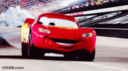 A Red Race Car From The Movie Cars Is Smiling GIF