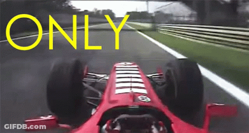 A Red Race Car Is Driving Down A Track With The Word Only Written In Yellow GIF