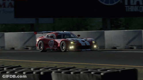 A Red Race Car With The Number 83 On It GIF