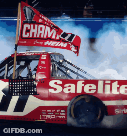 A Red Race Car With The Word Safelite On It GIF