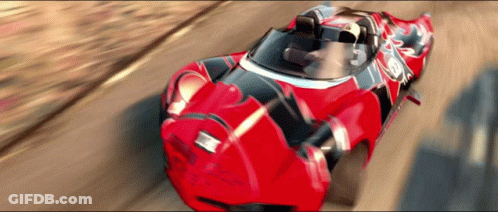 A Red Racing Car With The Number 12 On The Side GIF