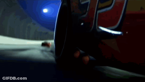 A Red Rusteze Race Car Is Driving Down A Track GIF
