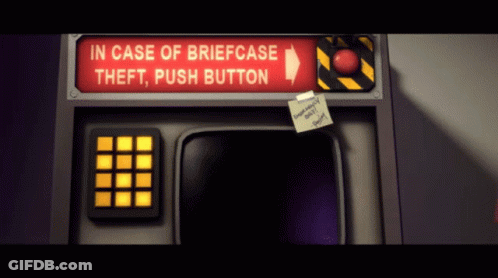 A Red Sign Says In Case Of Briefcase Theft Push Button On It GIF