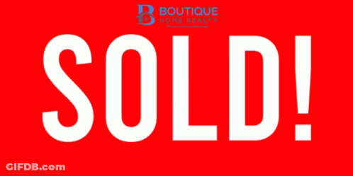 A Red Sign That Says Sold In White Letters On It GIF